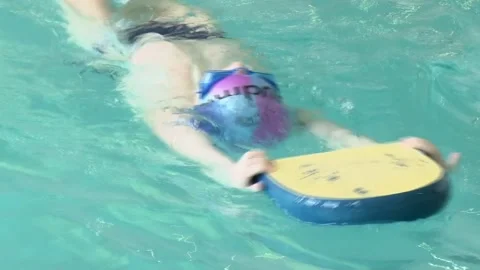 Children learn to swim in the pool. 스톡 동영상 147477483