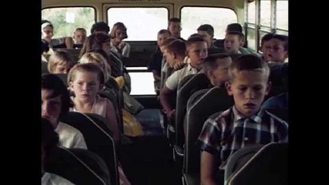 Children learn they have a responsibility to their bus driver to be well-behaved Stock Footage 143851563