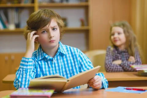 Children learning and doing homework in school classroom Stock Photos