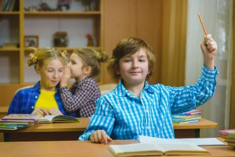 Children learning and doing homework in school classroom Stock Photos