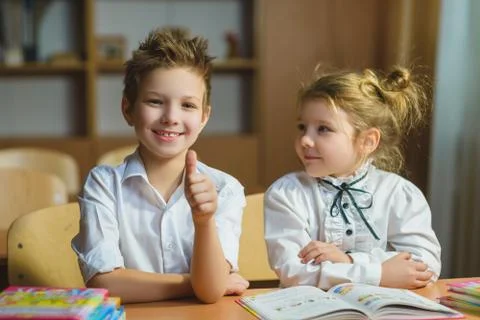 Children learning and doing homework in school classroom Stock Photos