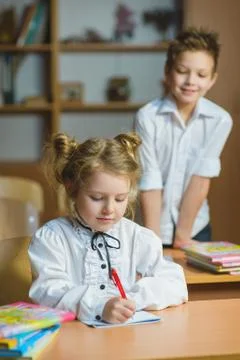 Children learning and doing homework in school classroom Stock Photos