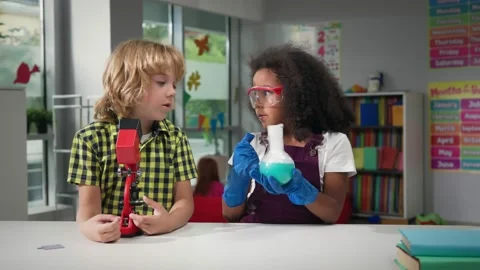 Children learning and doing science experiments in classroom. Stock Footage 205017455