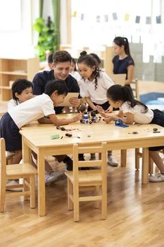 Children learning coding in classroom Stock Photos