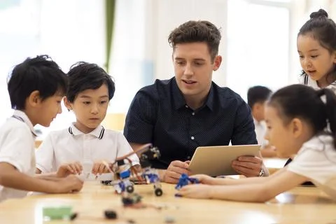 Children learning coding in classroom 스톡 사진