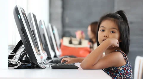 Children learning by computer in class room Stock Footage 24519040