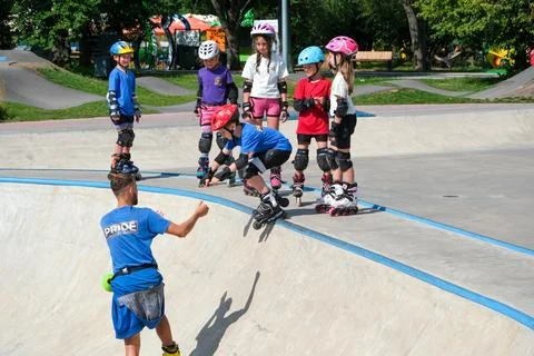 Children Learning Inline Skating at Outdoor Skatepark Stock Photos