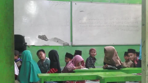 Children learning the Quran at a mosque Stock Footage 269707919
