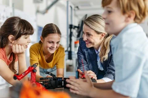 Children learning robotics in Elementary school. Young students building robot 写真素材