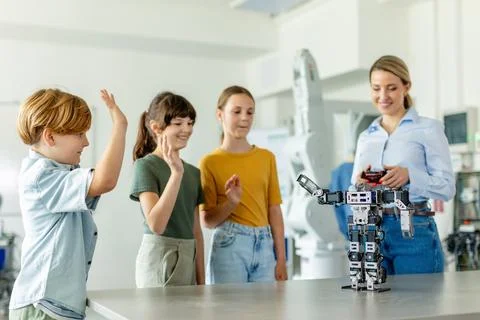 Children learning robotics in Elementary school. Young students building robot 写真素材