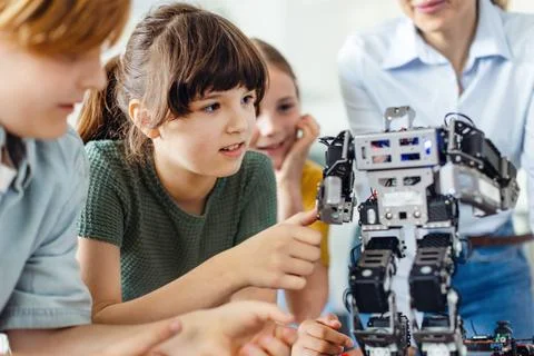 Children learning robotics in Elementary school. Young students building robot 写真素材