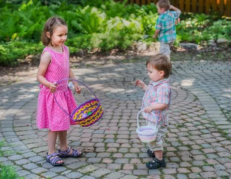 Children Looking for Easter Eggs Stock Photos