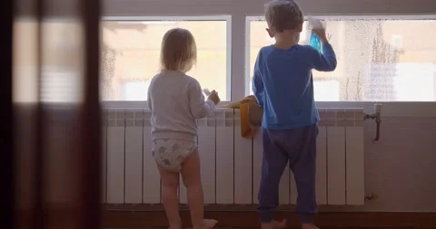 Children looking out of window Video stock 147560715