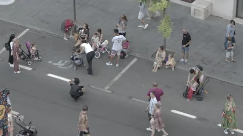 Children make bubbles on street in Bucharest Stock Footage 234017260