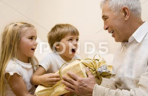 Children make a present to their grandpa Stock Photos