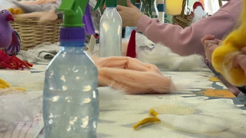 Children make a rabbit shape out of wool, children's master class on felting a t Stock Footage 306569647