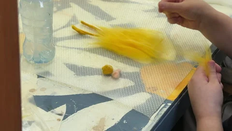 Children make a rabbit shape out of wool, children's master class on felting a t 스톡 동영상 306570224