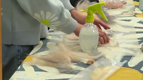 Children make a rabbit shape out of wool, children's master class on felting a t 스톡 동영상 306576944
