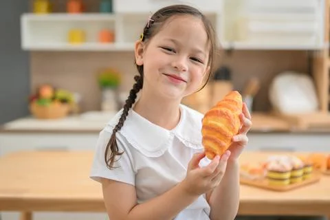 Children making bread in kitchen, Kids learning kitchen skill Stock Photos