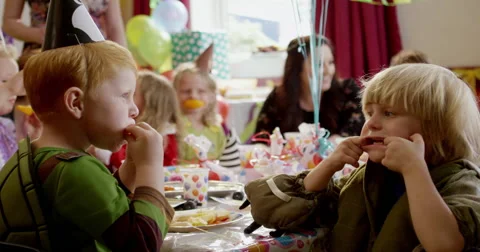 Children making funny faces during a birthday party Stock Footage 58573782