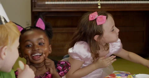 Children making funny faces during a birthday party in classroom Stock Footage 58578983