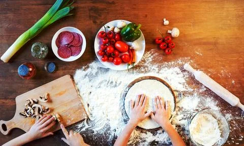 Children making pizza Stock Photos