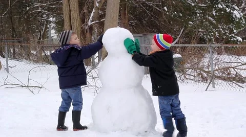Children Making a Snowman 스톡 동영상 47979135