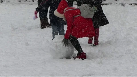Children making snowman Stock Footage 72381037