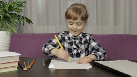 Children making video call doing distance education lessons at home. Webcam view Stock Footage 130537221