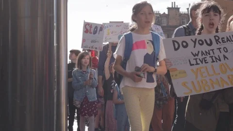 Children Marching [Jib]3ed Global Climate Strikes: [Slow motion] Edinburgh Stock Footage 117186964