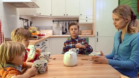 Children with mother drinking tea Stock Footage 73926106