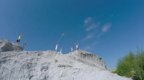 Children from the mountain run with a kite. Stock Footage 53466464