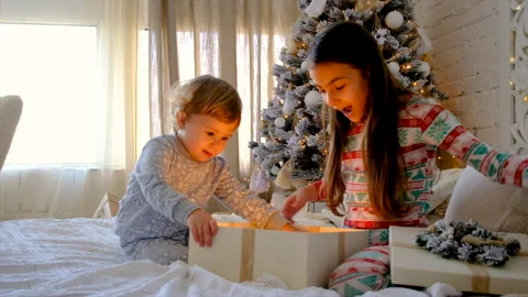 Children open a Christmas gift. Selective focus. Stock Footage 221147860