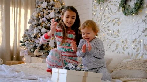Children open a Christmas gift. Selective focus. Stock Footage 221644842