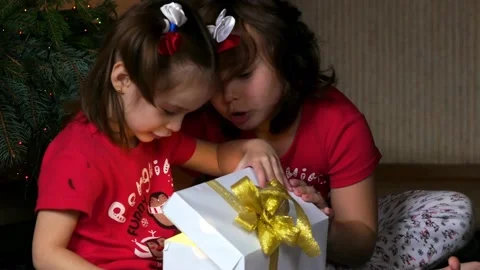 Children open a Christmas present. Stock Footage 164761032