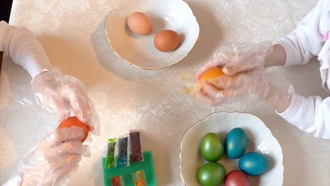 Children paint Easter eggs Stock Footage 125329932