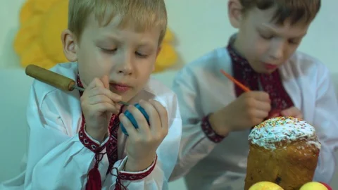 Children paint traditional Easter eggs Stock Footage 74830274