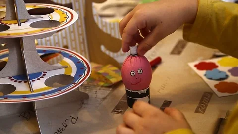 Children is painting Easter eggs Stock Footage 87644172