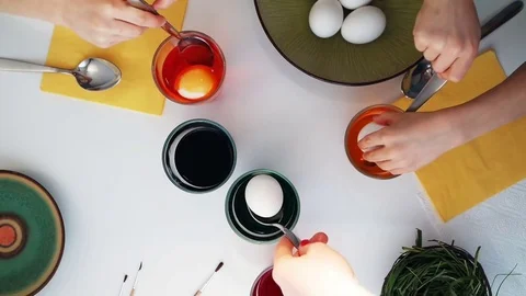 Children painting Easter eggs. Top view Stock Footage 72160707