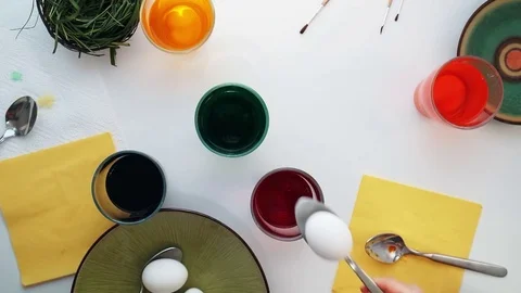 Children painting Easter eggs. Top view Stock Footage 72161203