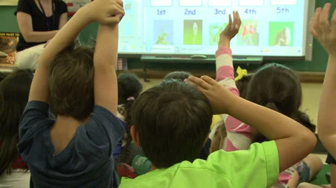 Children participating in class (3 of 4) Stock Footage 32302332