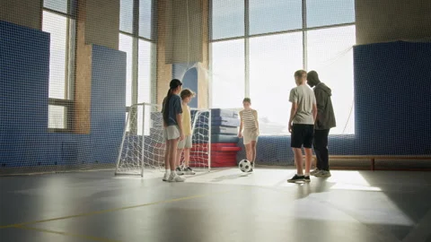 Children Passing Ball in Circle Doing Soccer Drills in Gym Stock Footage 327042061