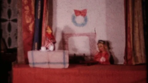 Children perform hand puppet show at home 1950s vintage home movie 4172  Stock Footage 75549763