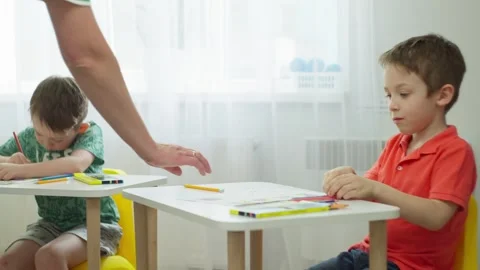 Children perform the teacher's tasks at their desks lesson in primary school. Stock Footage 255996832