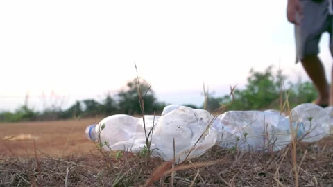 Children pick up bottle plastic to bin bag ,volunteer and save environment Video stock 158532032