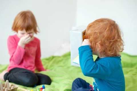 Children play on the bed Stock Photos