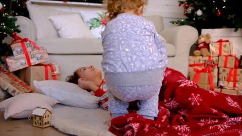 Children play with a blanket under the tree. Selective focus. Stock Footage 221622559
