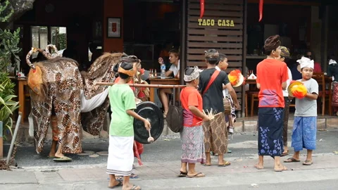 Children play cymbals show performance near street cafe Video stock 102488563