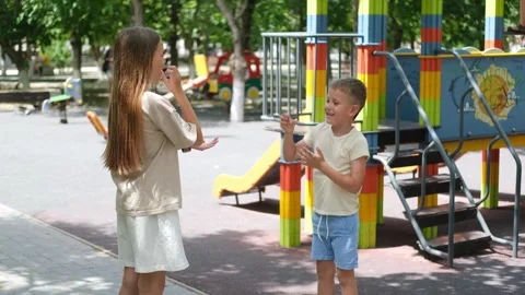 Children play a game of stone, ssissors. Stock Footage 302800332