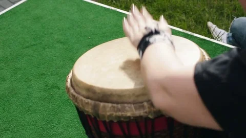 Children play on the Indian drum Stock Footage 76571517